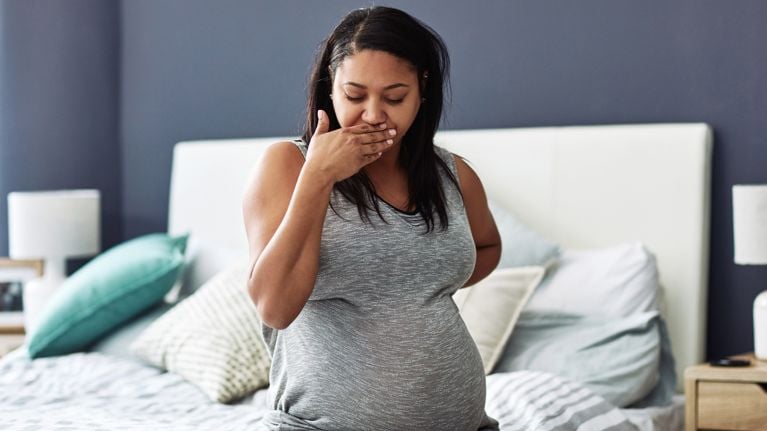 Cropped shot of a pregnant woman feeling nauseous